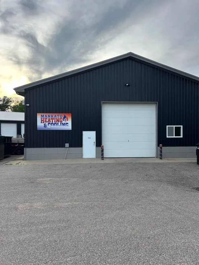 The Mankato Heating & Cooling building exterior with the company sign at dusk