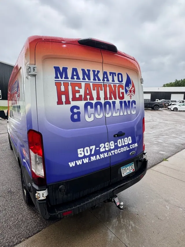 The rear of a Mankato Heating & Cooling service van showing the company logo and website